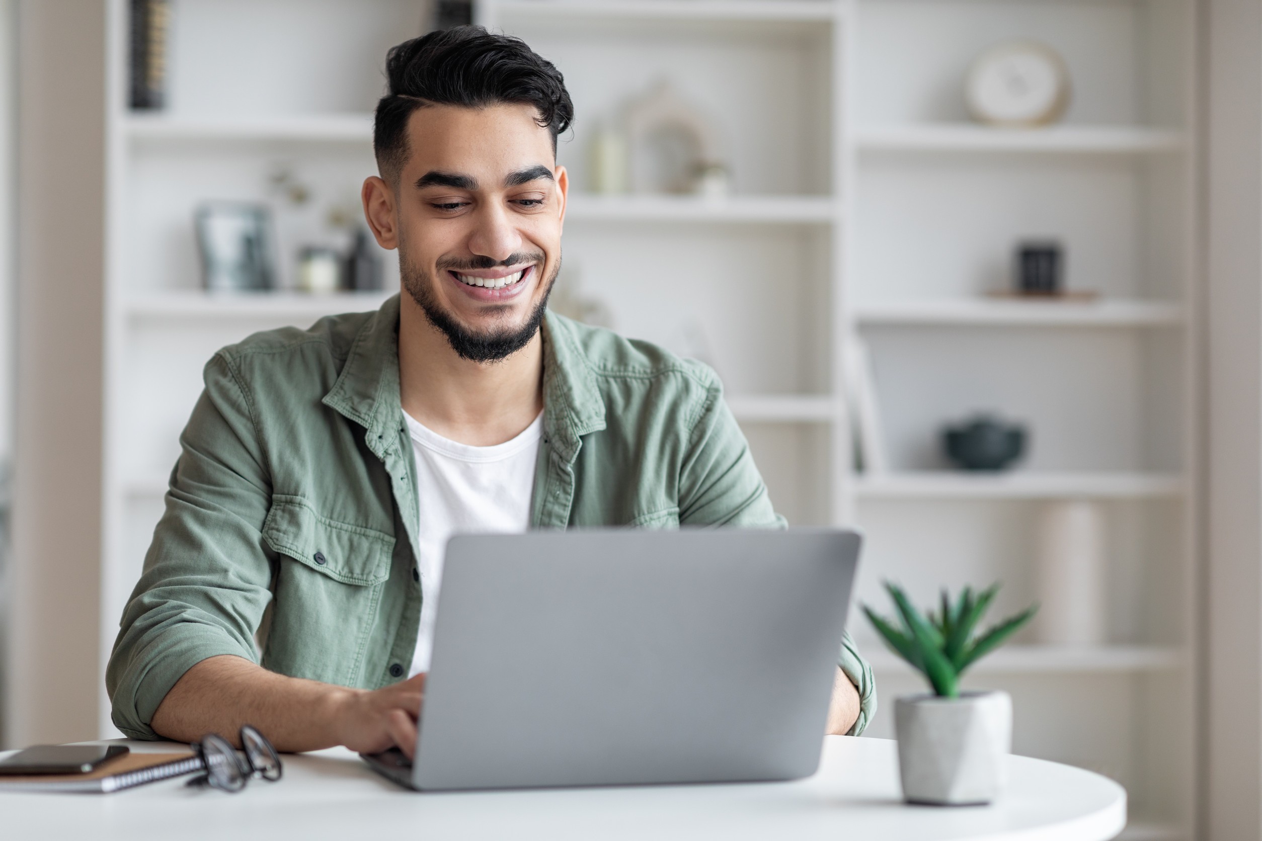 A Boy Using A Laptop