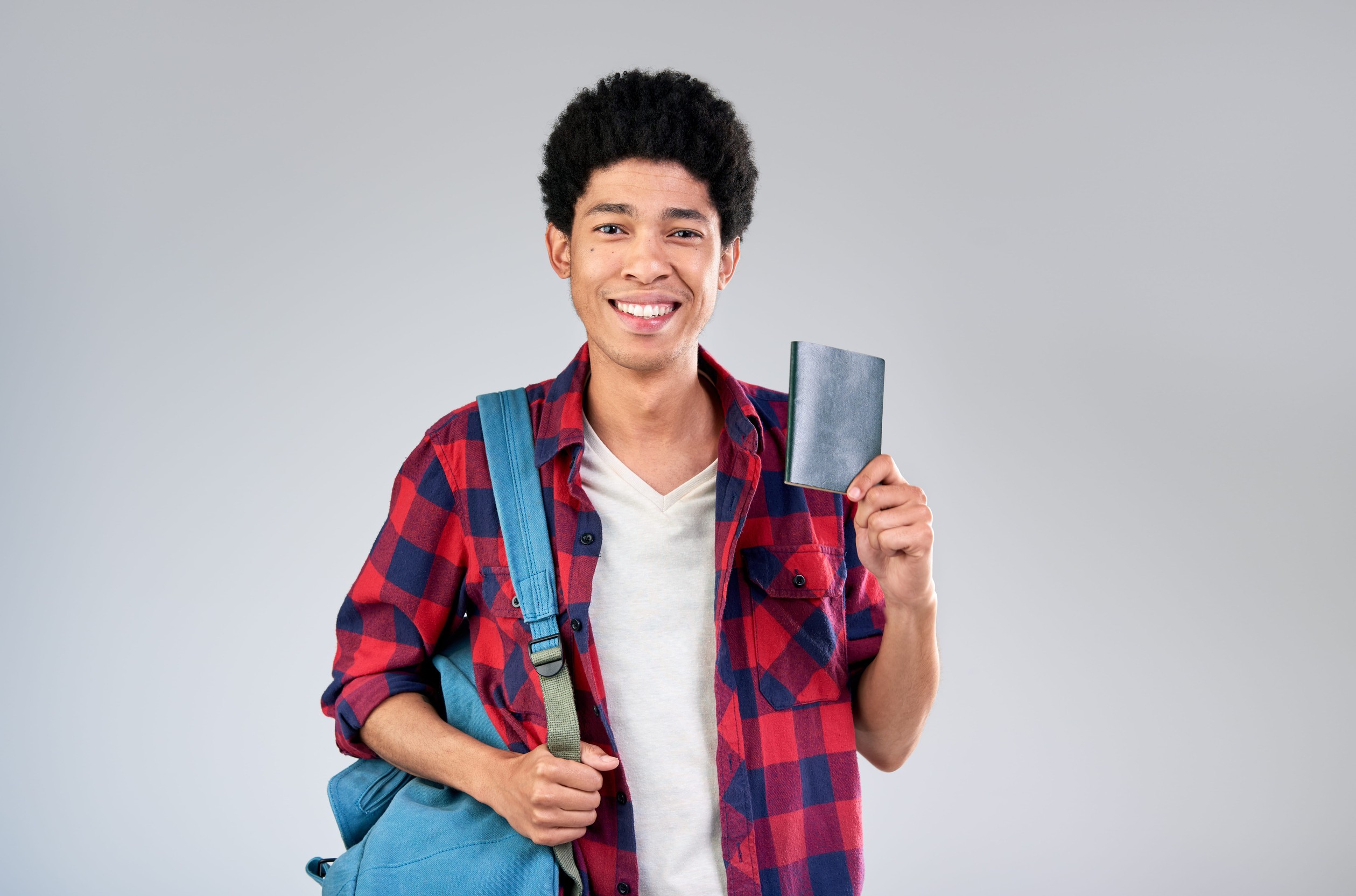 A Student Holding A Passport