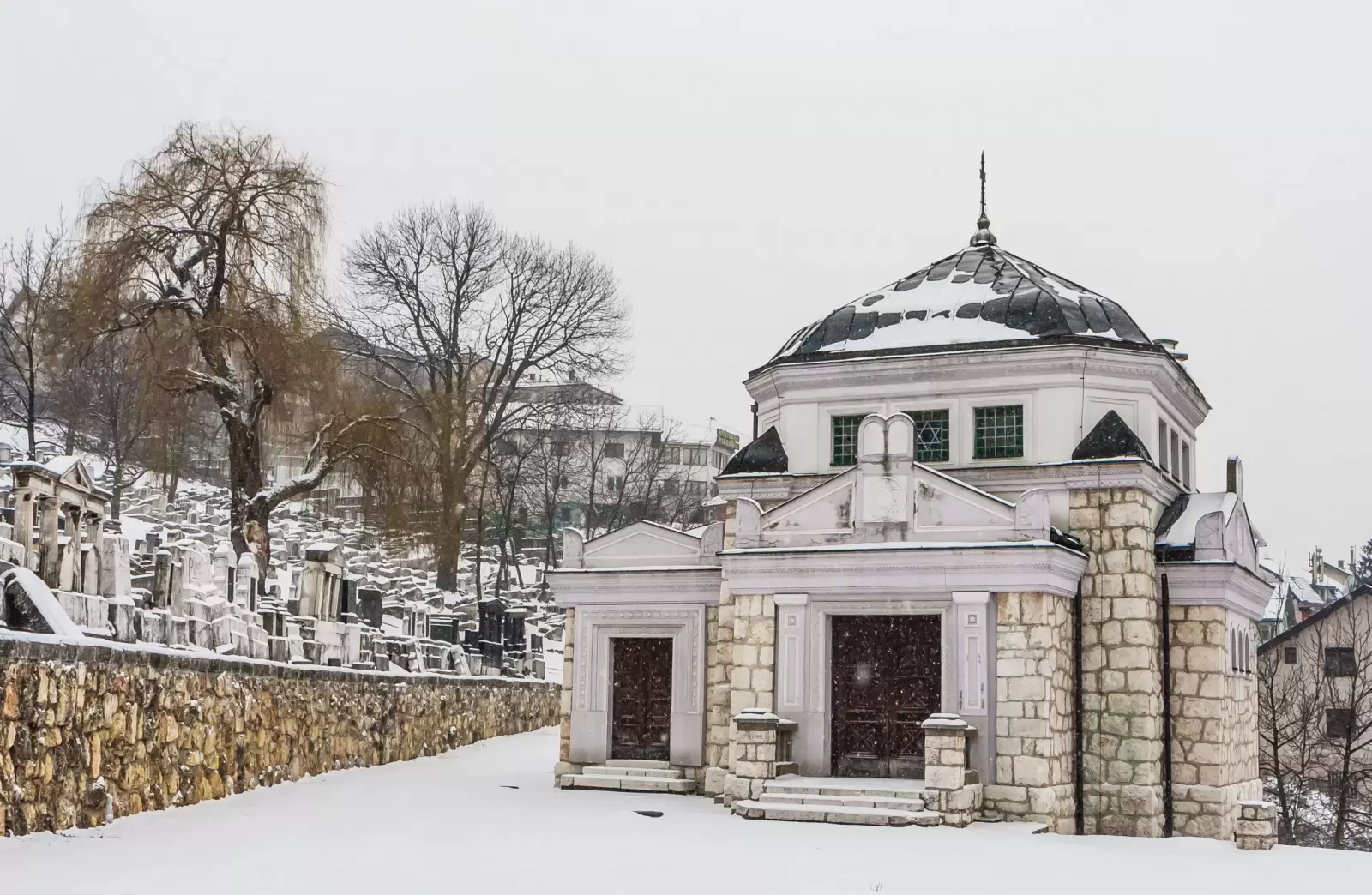 adin near main entrance with an old wall bosnia herzegovina