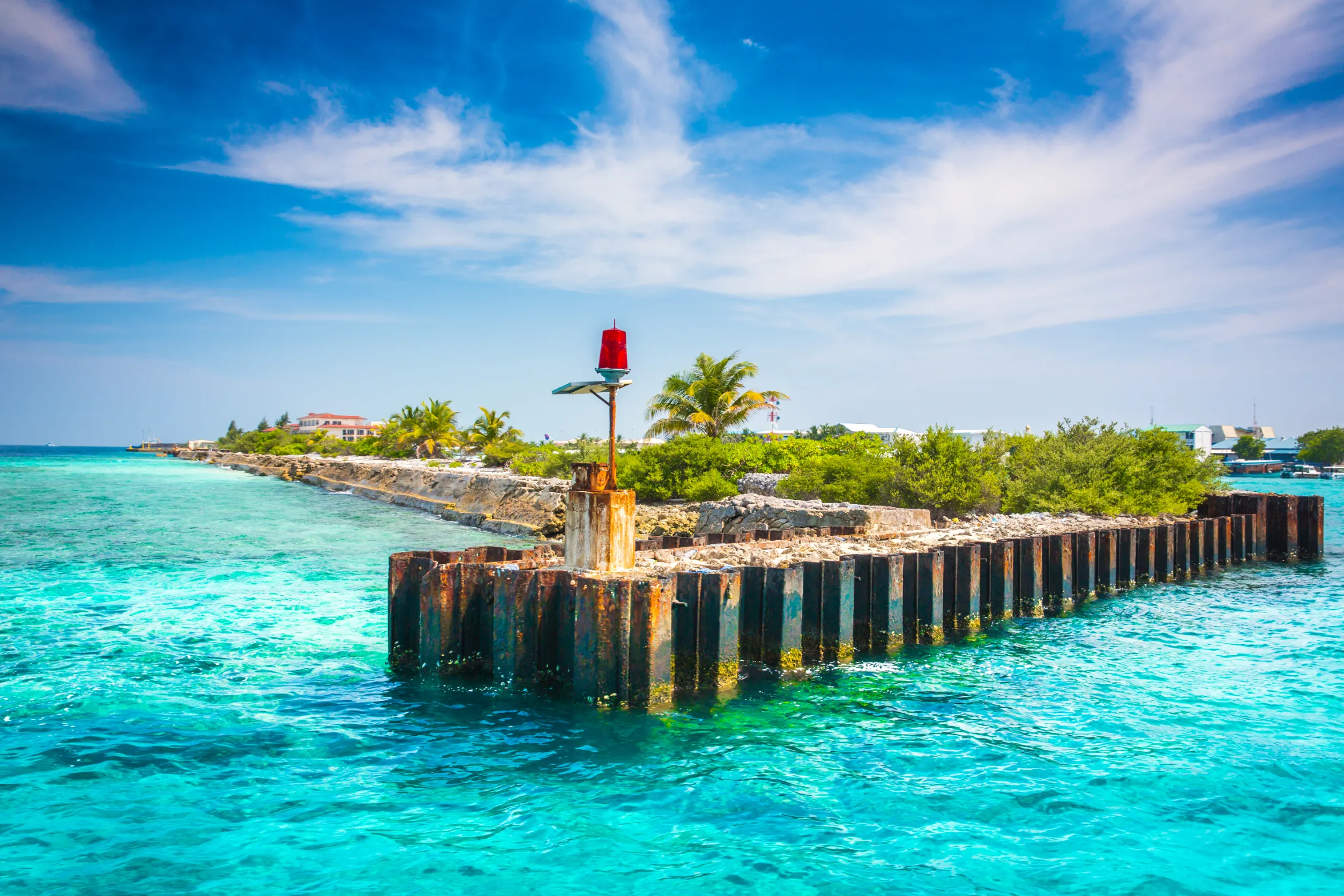 barrier to the sea with a red lantern maldives