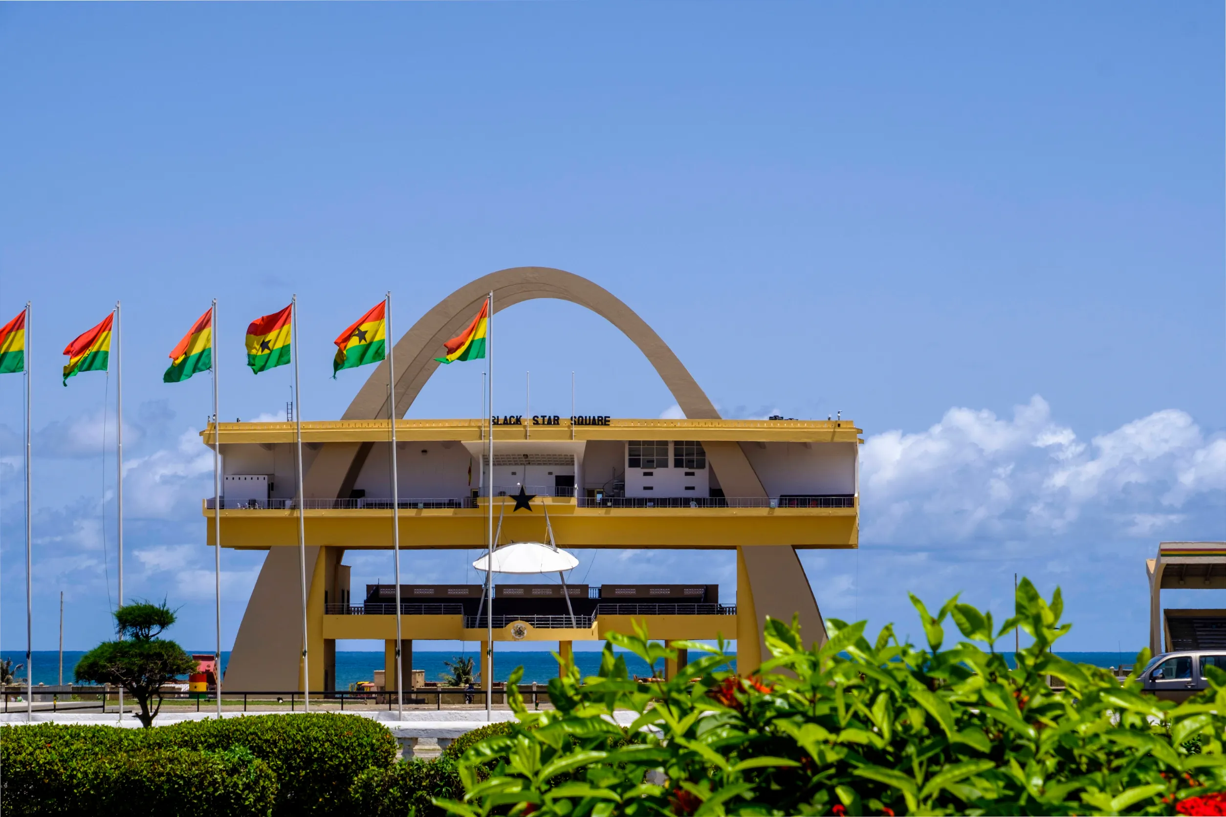 black star square independence arch and flags of ghana