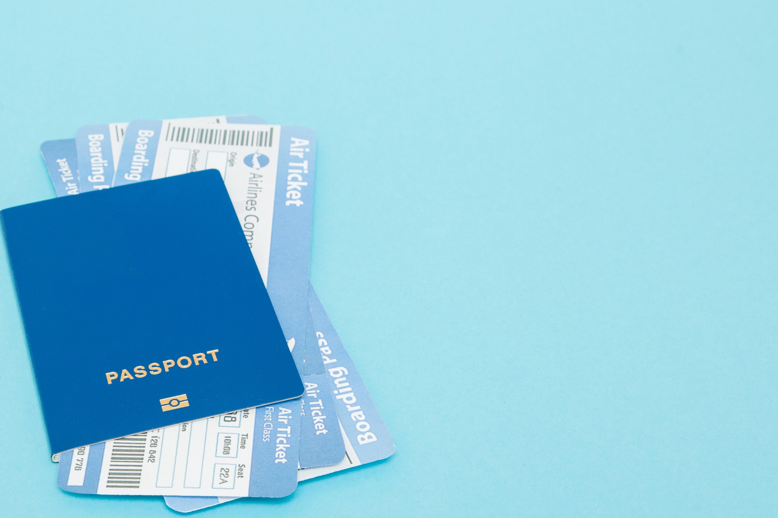 Blue passport with boarding passes