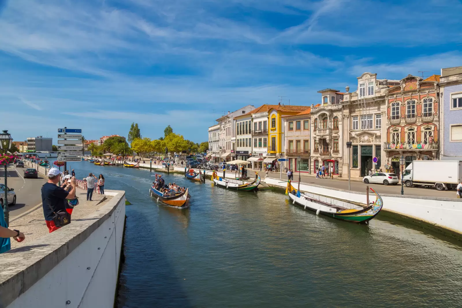 boats on main city canal in aveiro portugal in a beautiful