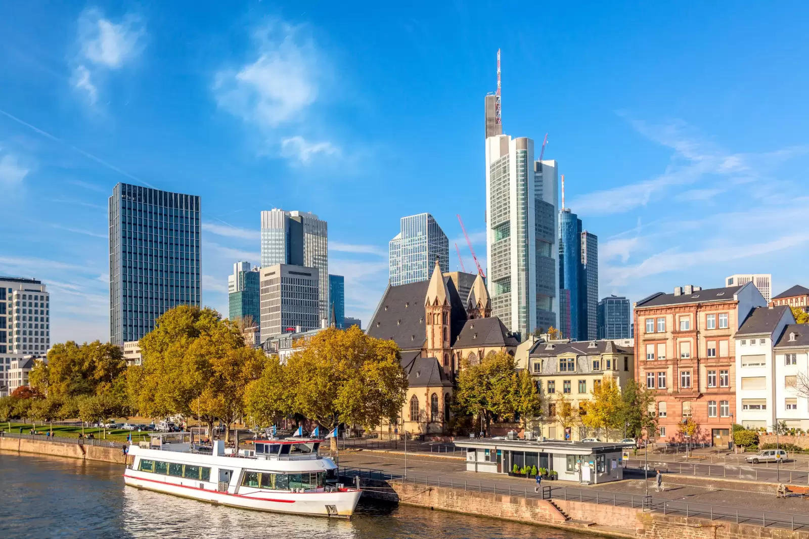 cityscape skyline of business district with skyscrapers and cruise ship during