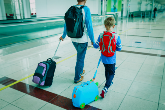 Father And Son At The Airport