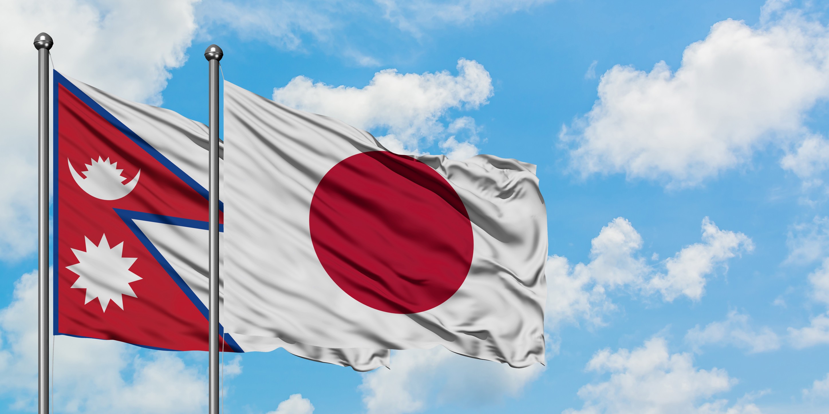 Flags of Nepal and Japan waving