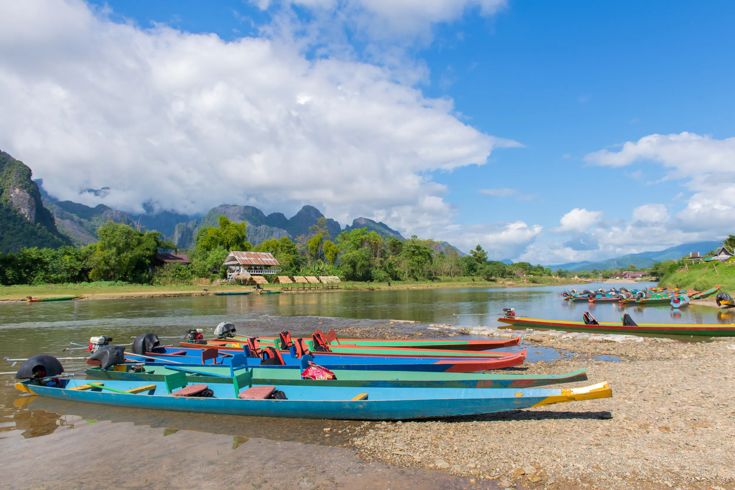 long tail boats song river vang vieng laos
