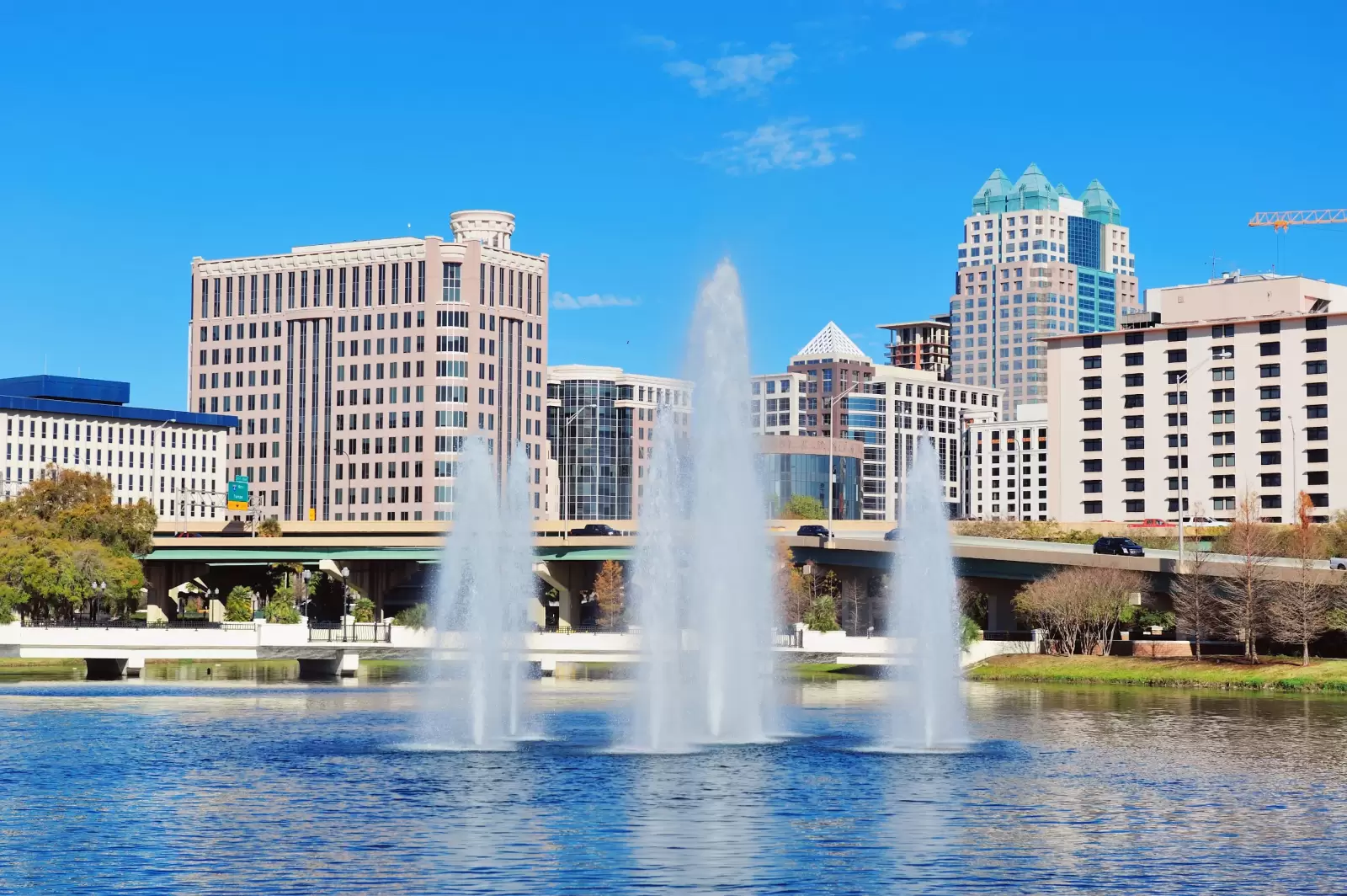 orlando lake lucerne panorama in the morning with office buildings bridge and fountain