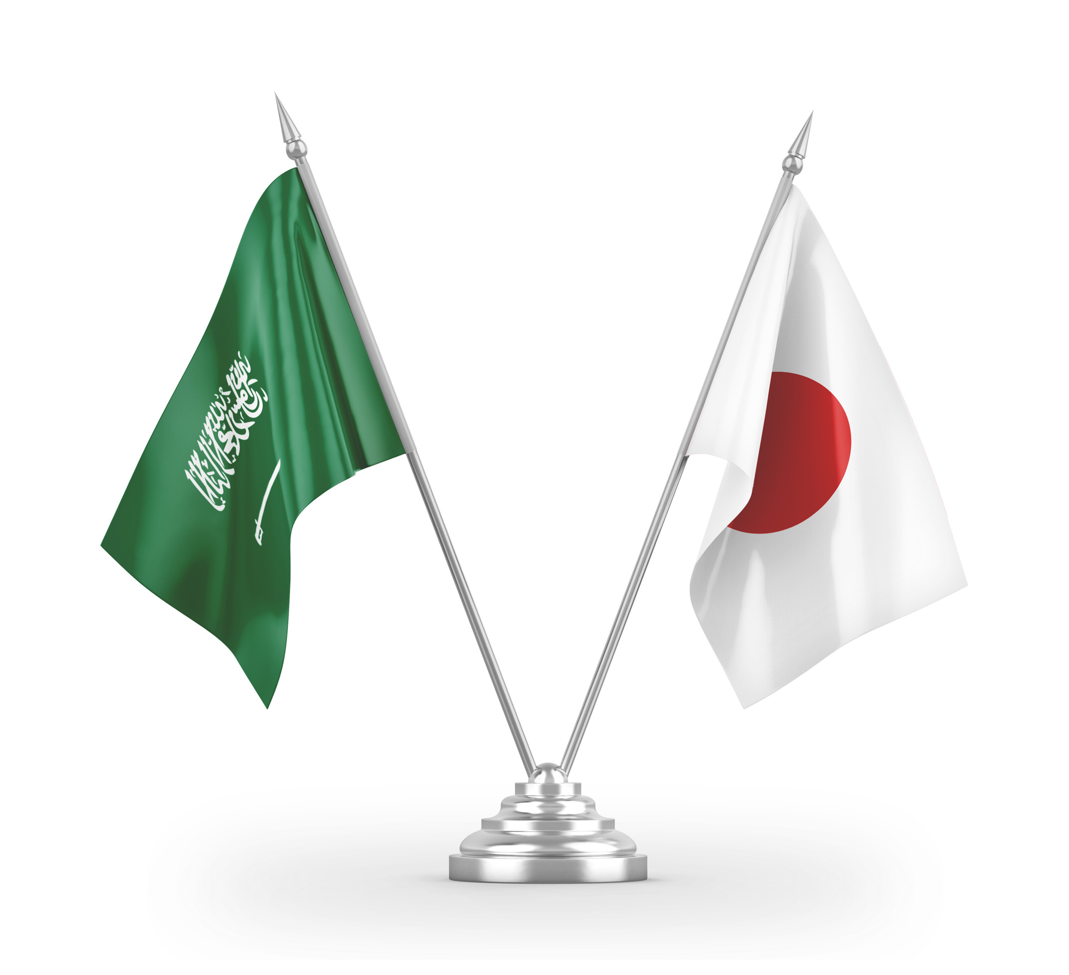 Crossed flags of Saudi Arabia and Japan on a silver stand