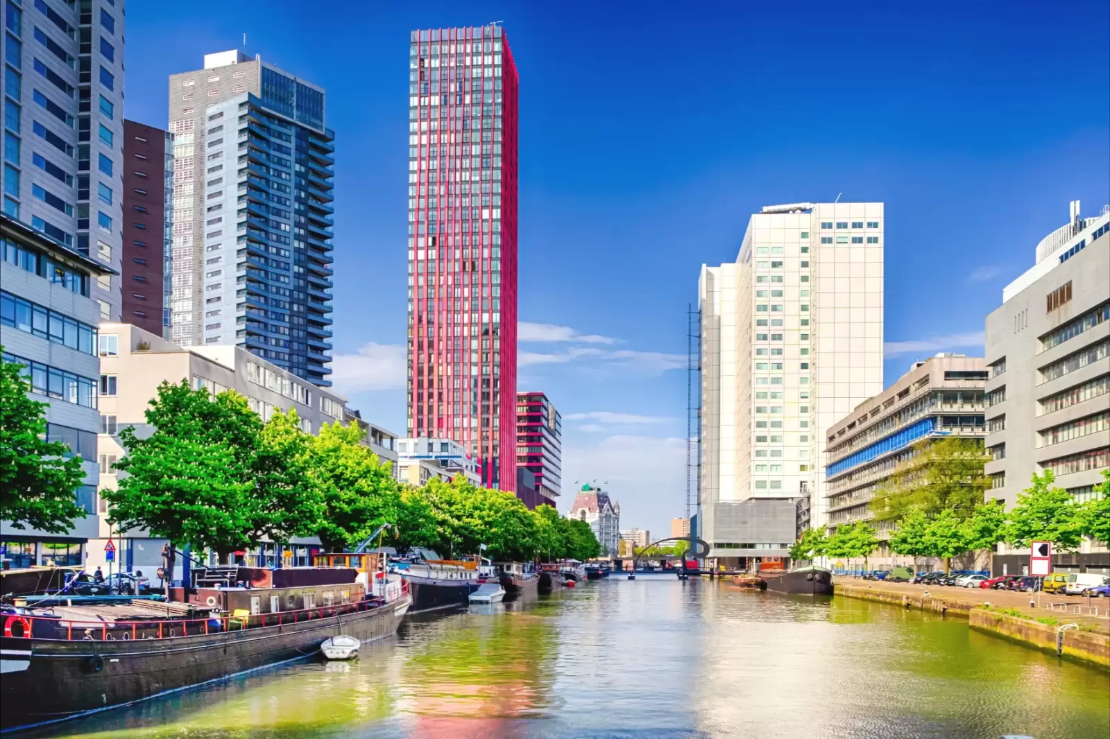 the water canal and lines of barges in rotterdam netherlands
