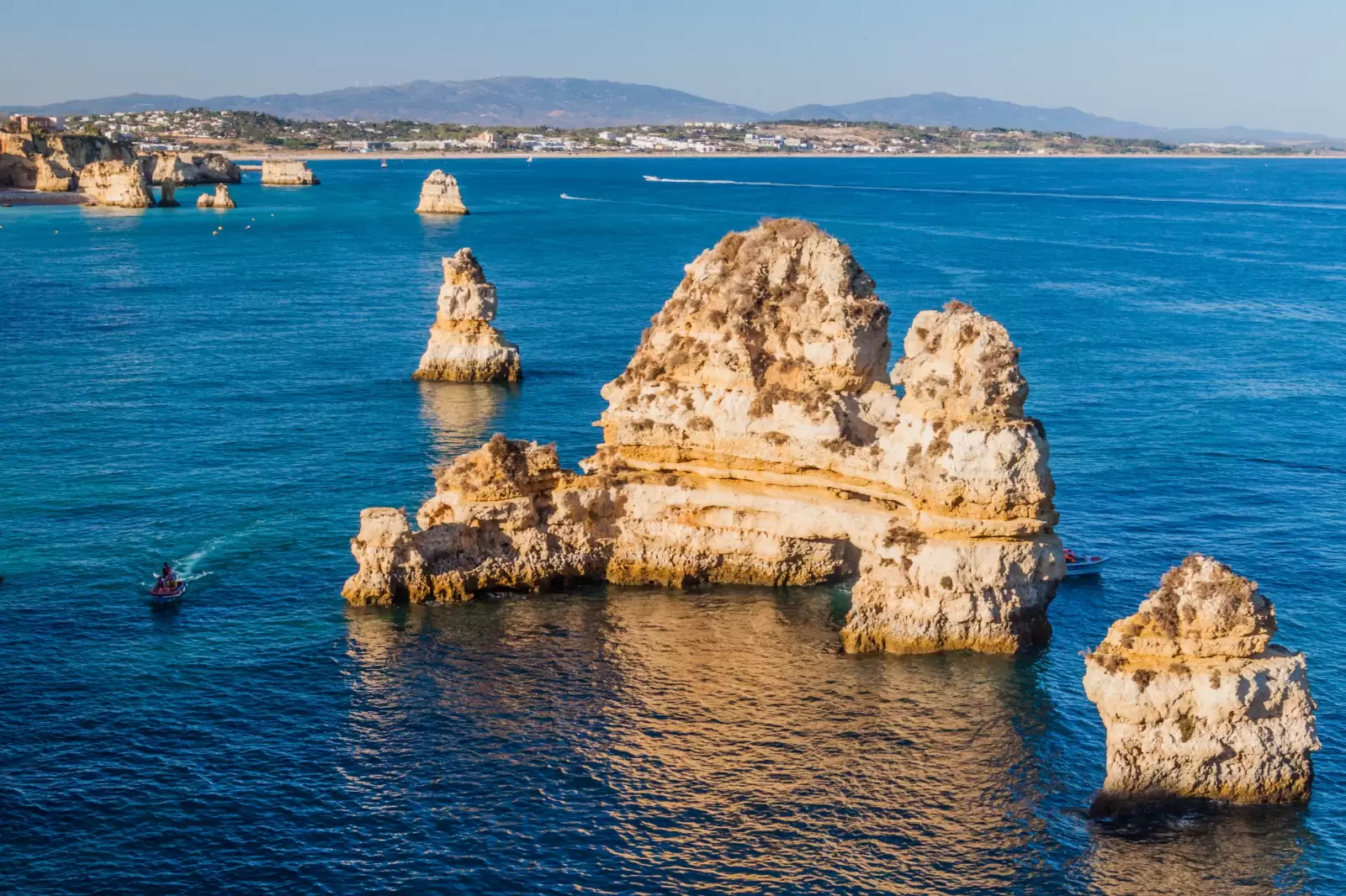 tourist boat at the cliffs lagos portugal