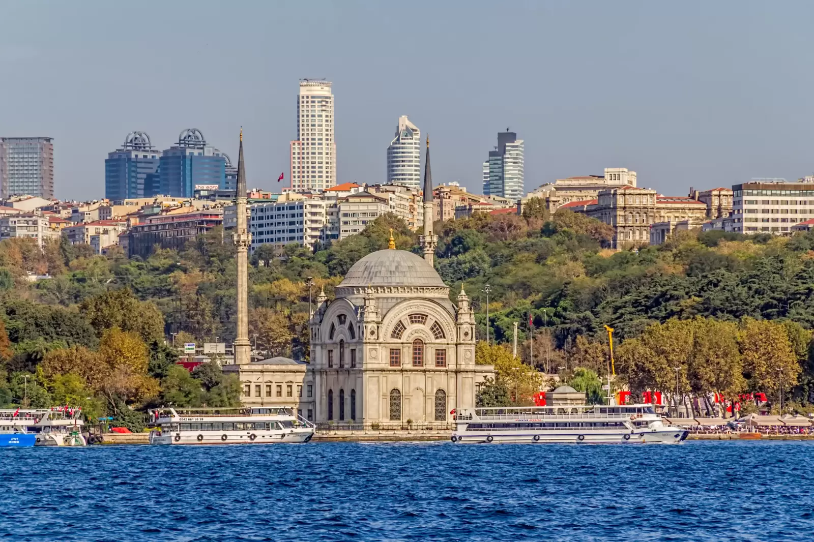 tourist ships crusing around dolmabahce mosque