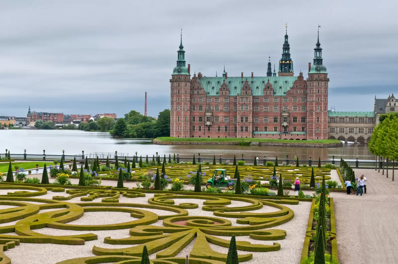 tourists visiting frederiksborg palace and the baroque gardens