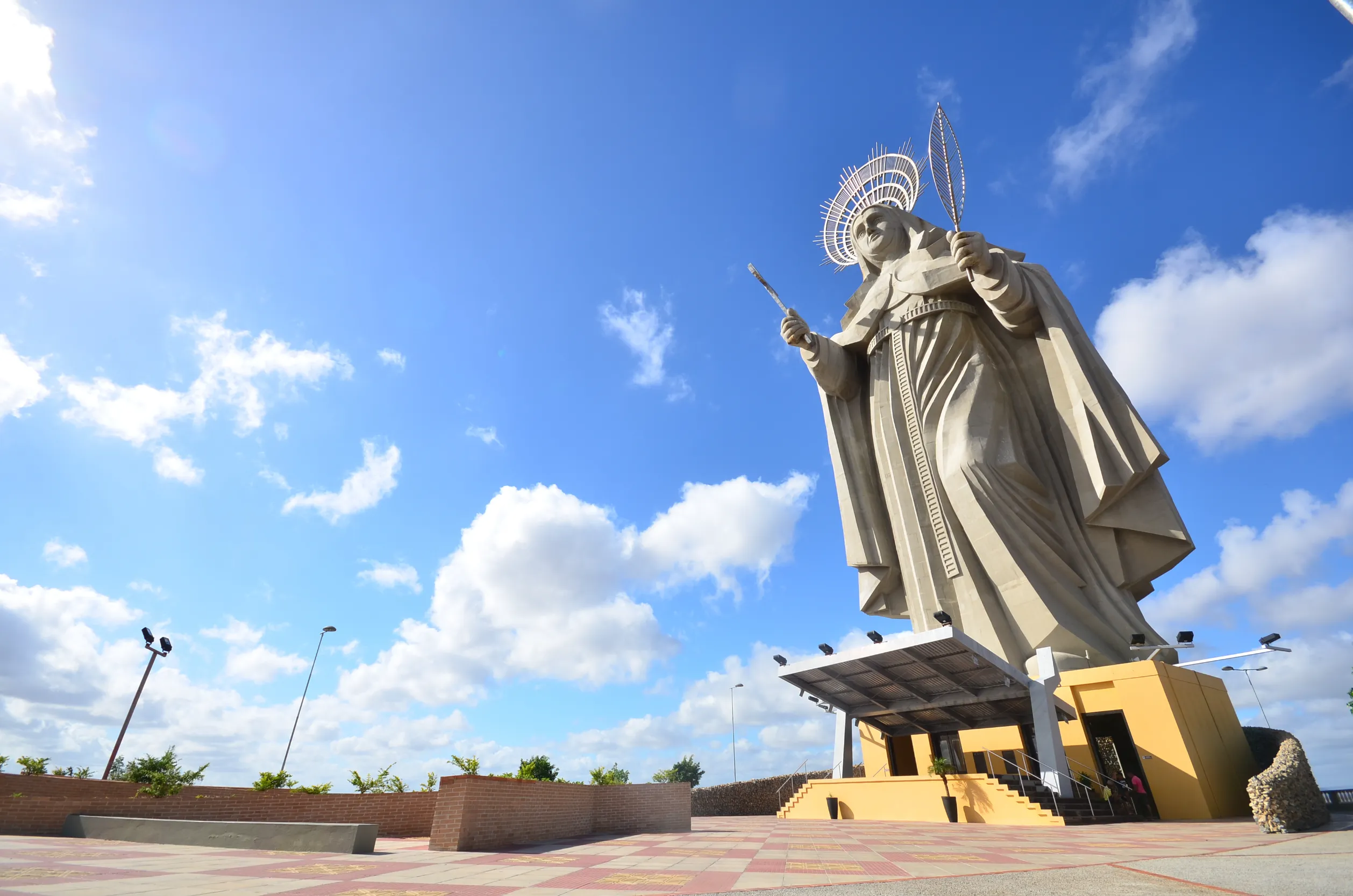 view of the courtyard of the largest catholic statue in the