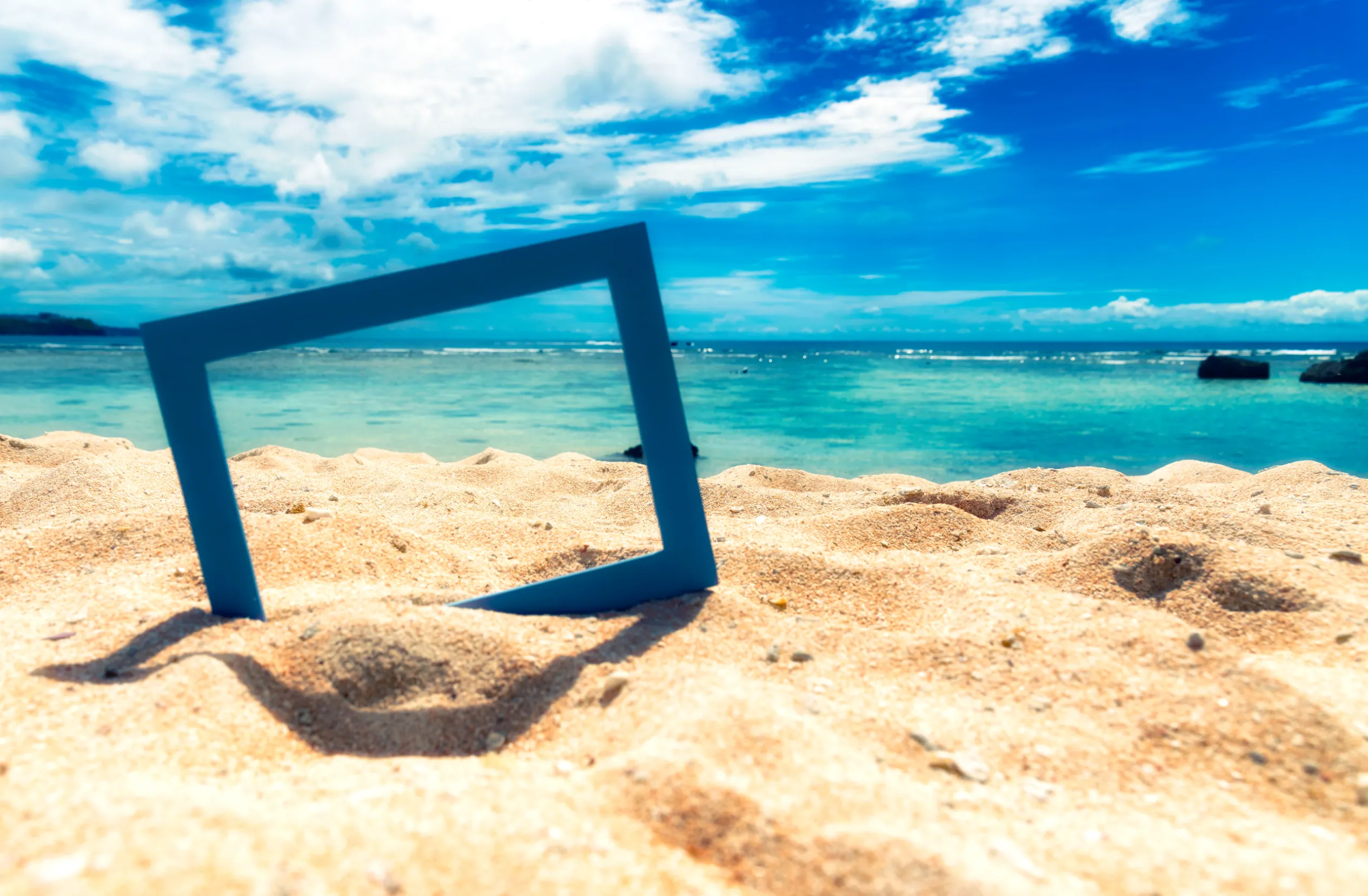 white sand beach with crystal clear blue water in the tropics